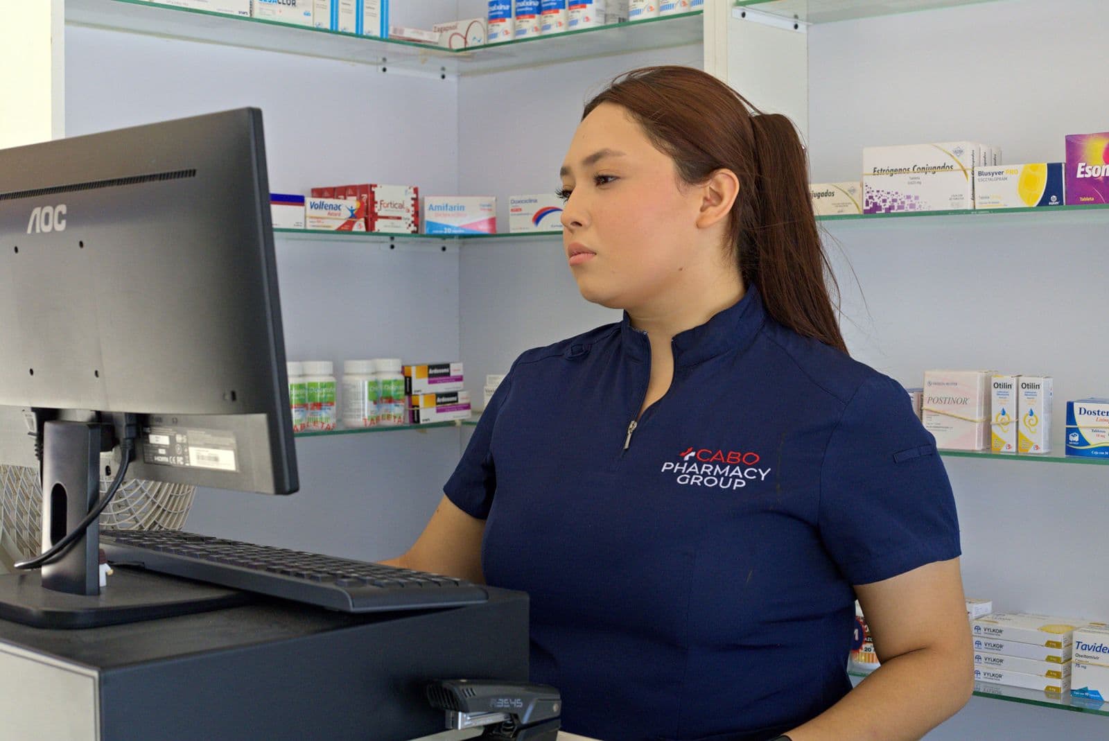 Team member serving at the Ocean Pharmacy counter